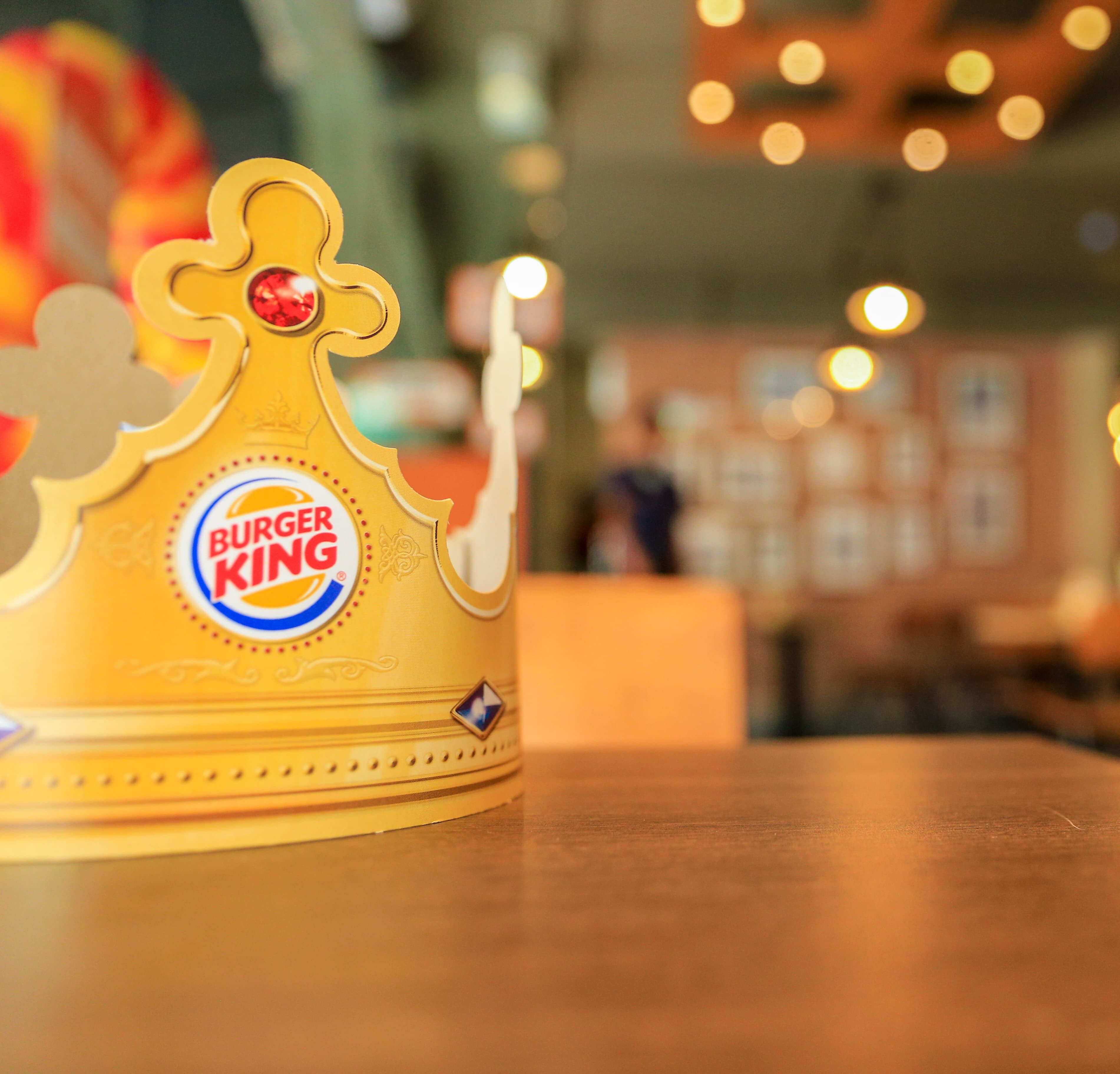 A Burger King crown on the table at a Burger King restaurant