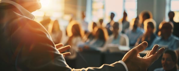 Someone presenting to a corporate audience