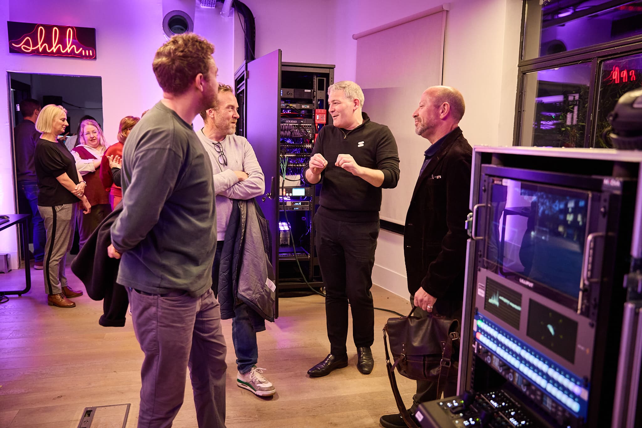 CEO Mark Anand talking to guests behind the scenes at the studio launch