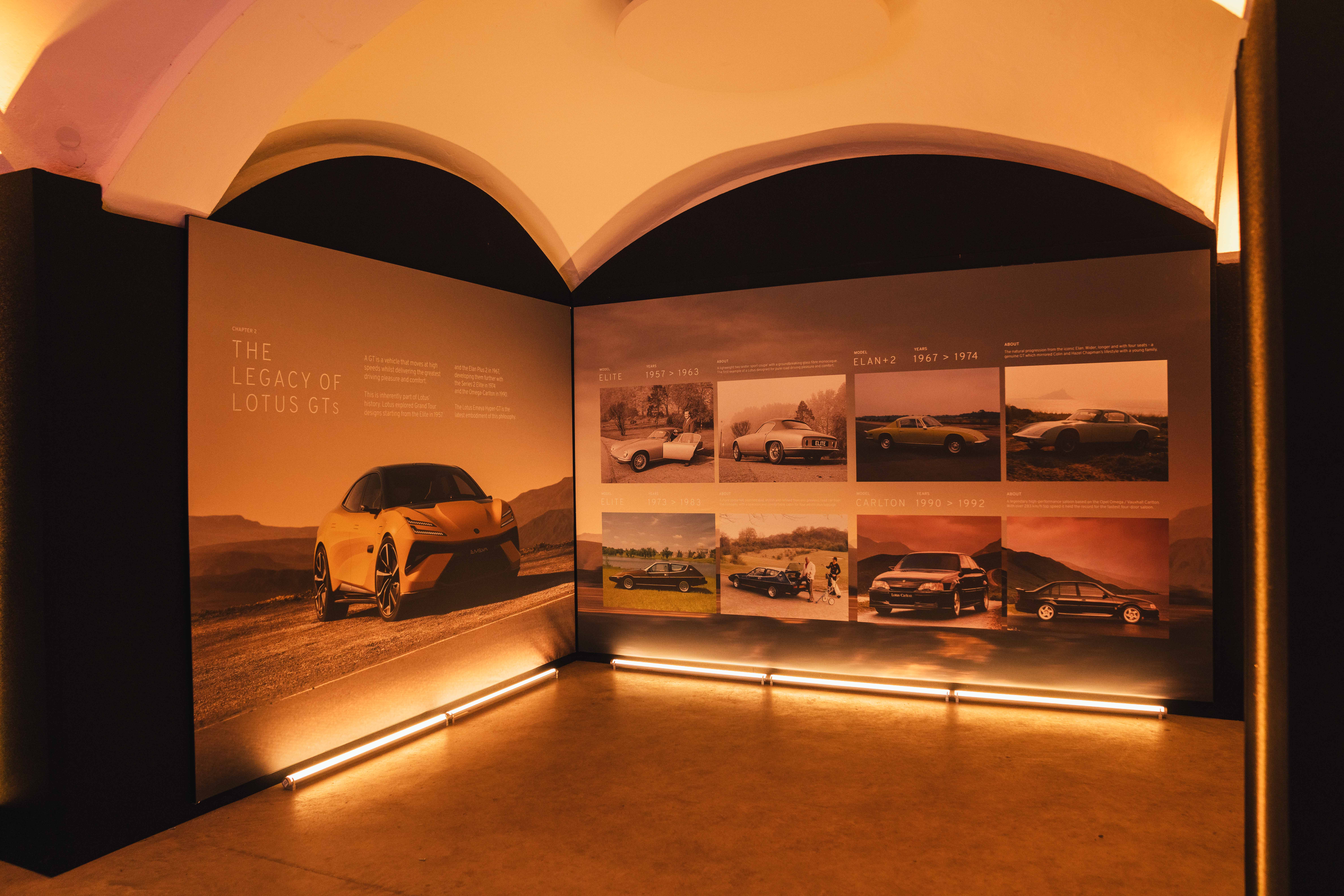 An up-light board displaying the history of Lotus and its various cars